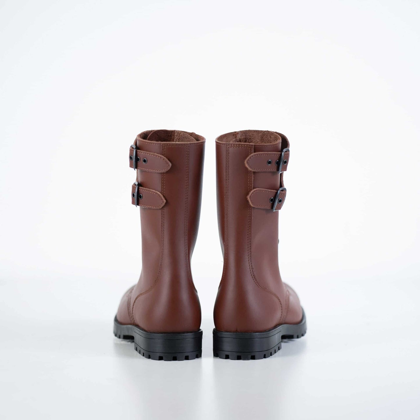 Samelin light brown leather boots with dual buckle accents and sturdy black sole