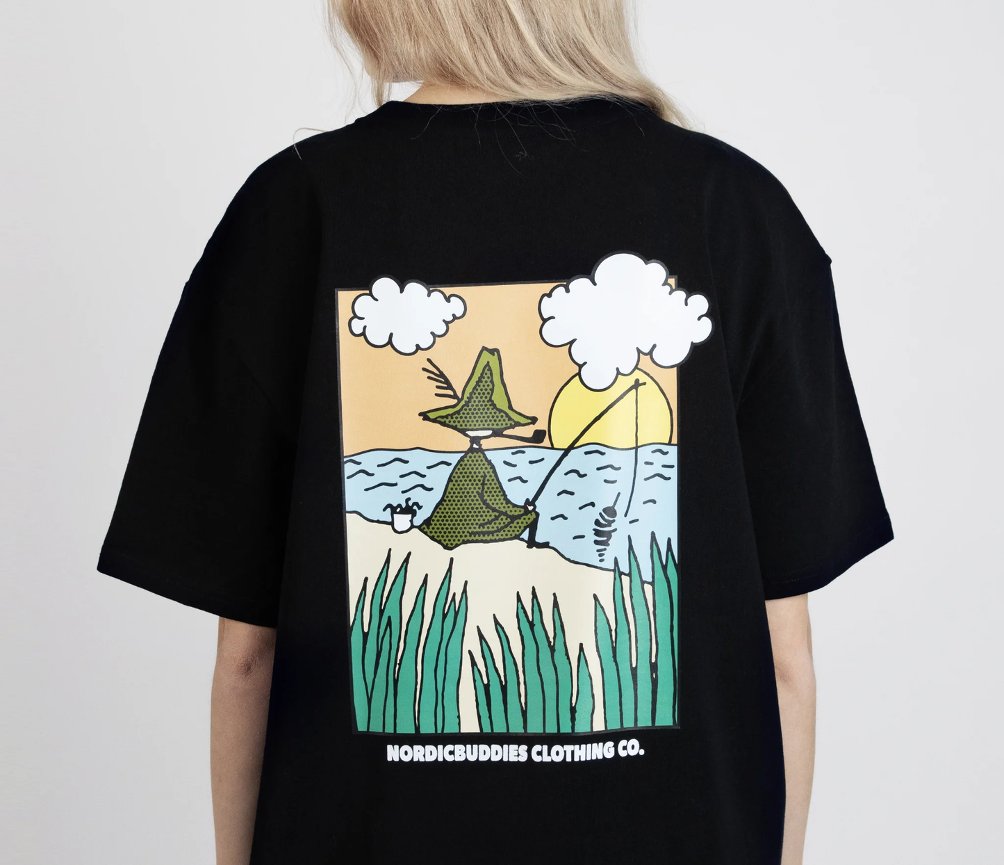 Moomin by NordicBuddies Snufkin fishing t-shirt featuring a colorful graphic design on black fabric