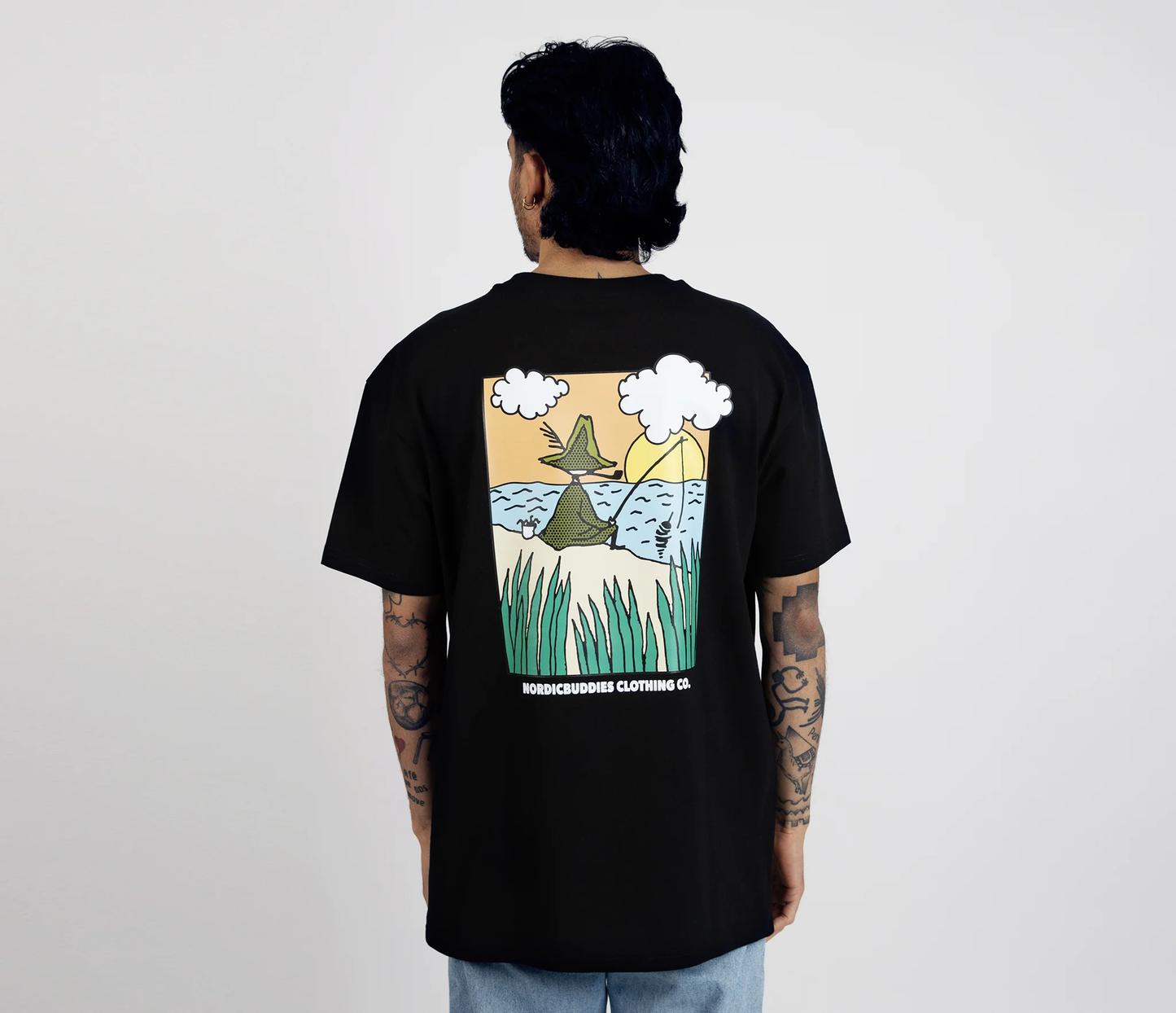 Back view of a Moomin by NordicBuddies Snufkin fishing t-shirt featuring a colorful graphic design