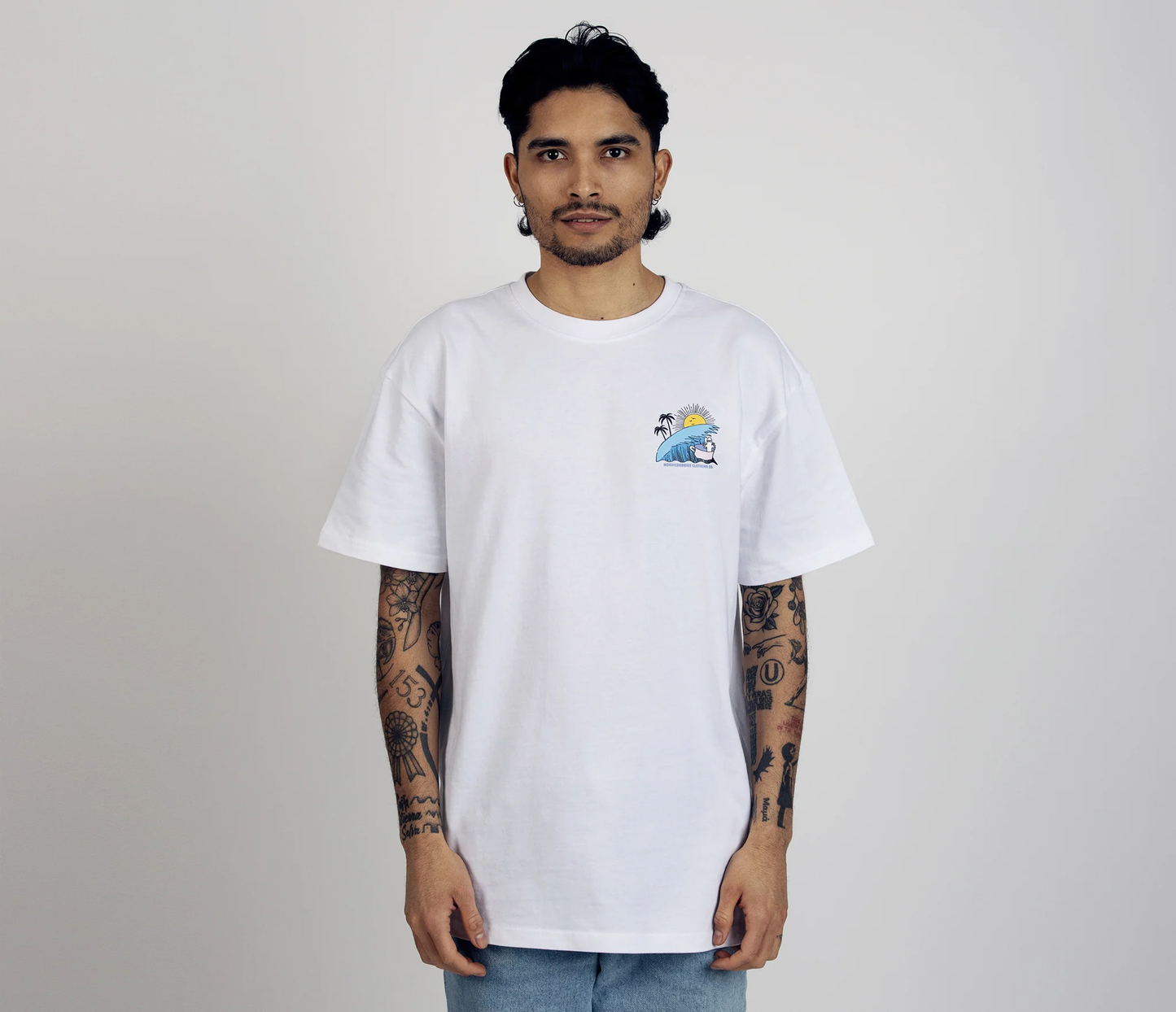 White surf trip t-shirt by Moomin featuring colorful graphic on chest for casual beachwear