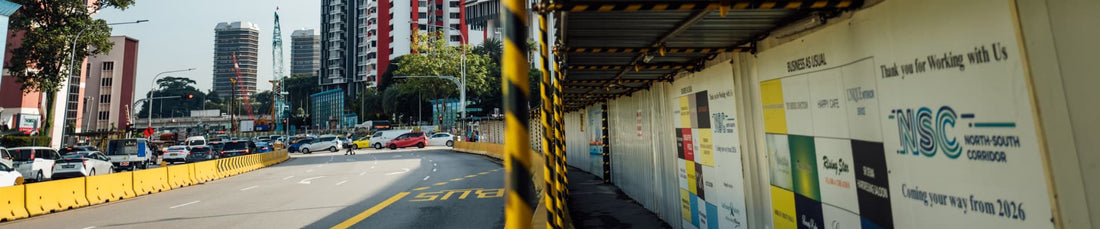 City street panorama with yellow construction barriers and hoarding walkway by high rise buildings daypack nord noel review