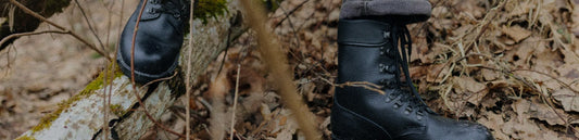 Durable M77 military boots for everyday wear showcased in a natural outdoor setting