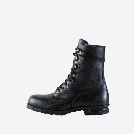 A close-up of M77 Norwegian combat boots, showcasing their durable full-grain leather and rugged design