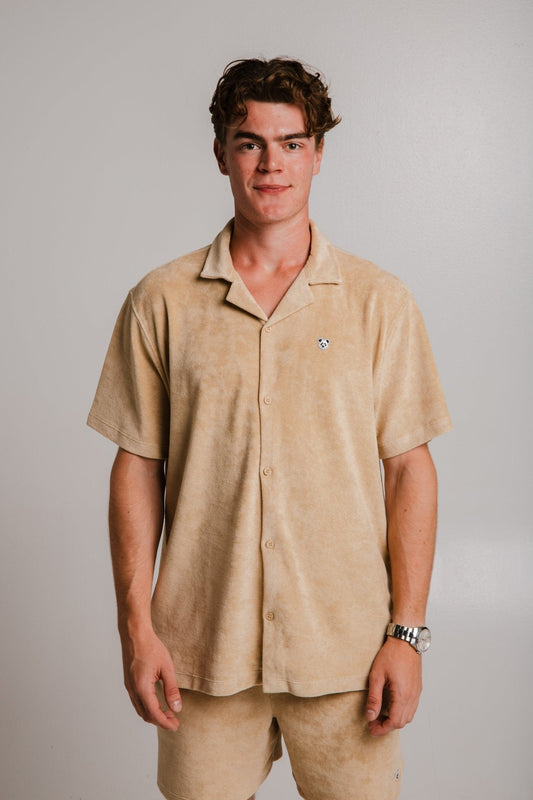 Sossu light brown panda t-shirt with short sleeves and button-up front worn by male model