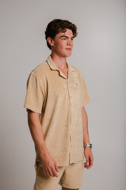 Sossu light brown panda t-shirt worn by male model with short sleeves and collar