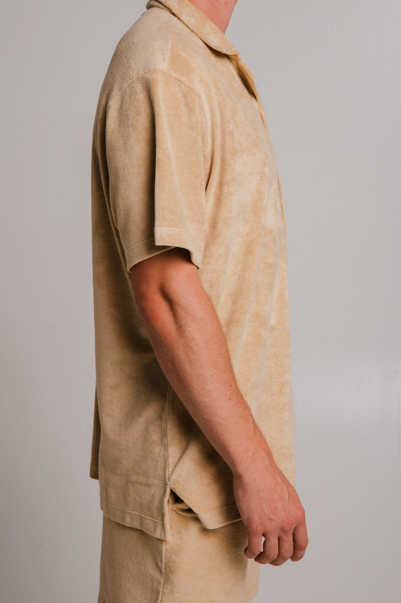 Sossu light brown panda t-shirt with short sleeves and relaxed fit shown from side view
