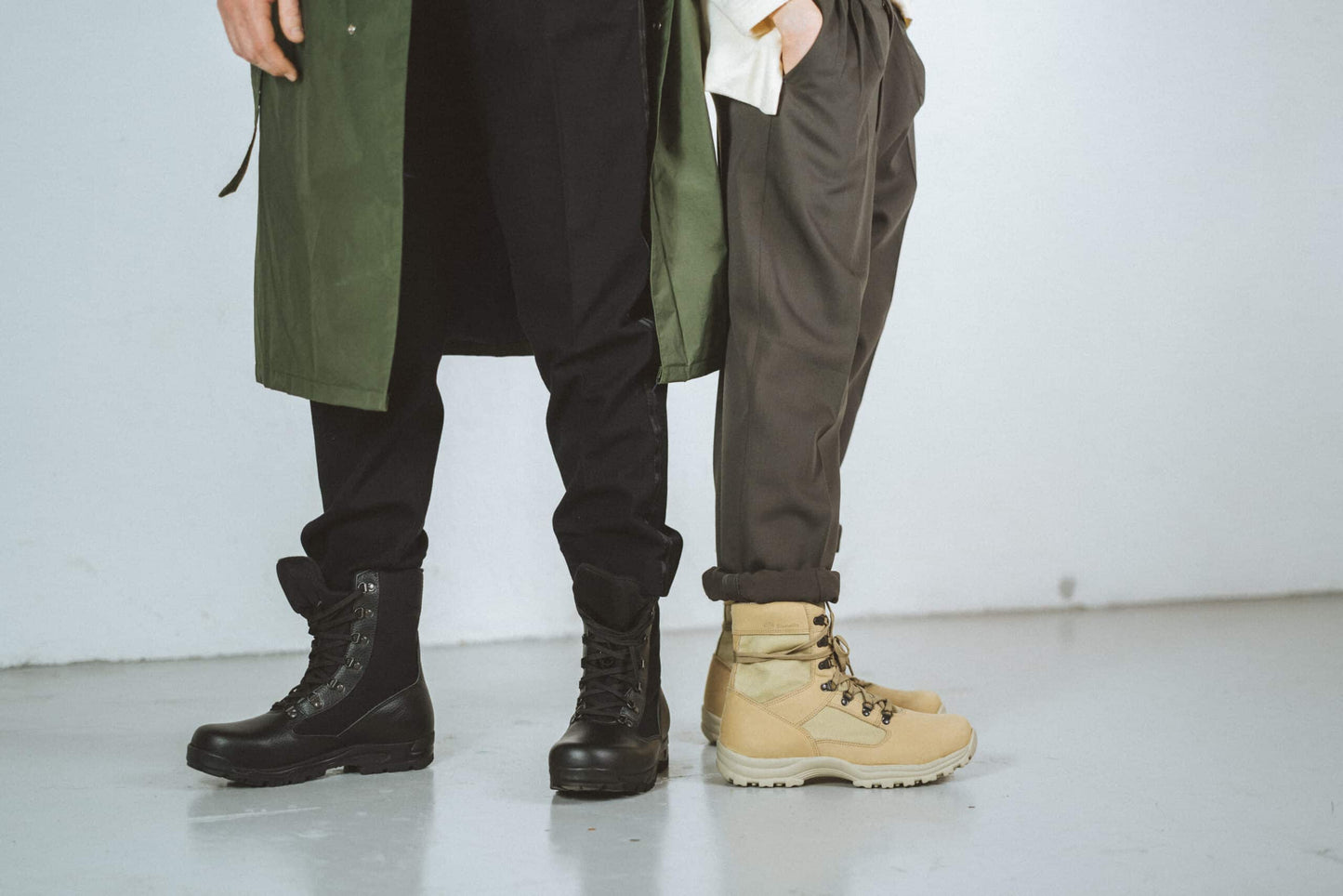 Samelin desert hiking boots black shown alongside beige hiking boots for outdoor adventures