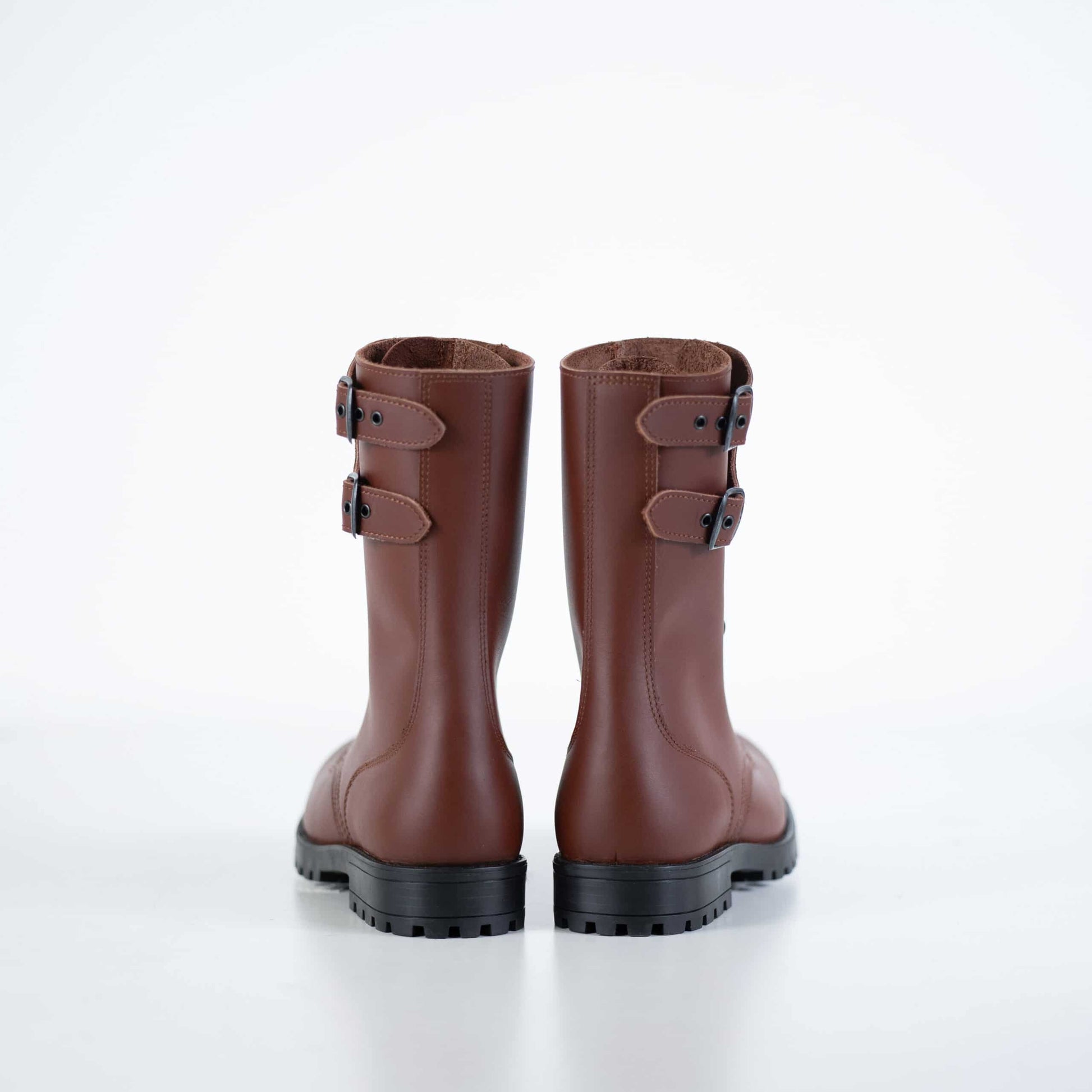 Samelin light brown leather boots with dual buckle accents and sturdy black sole